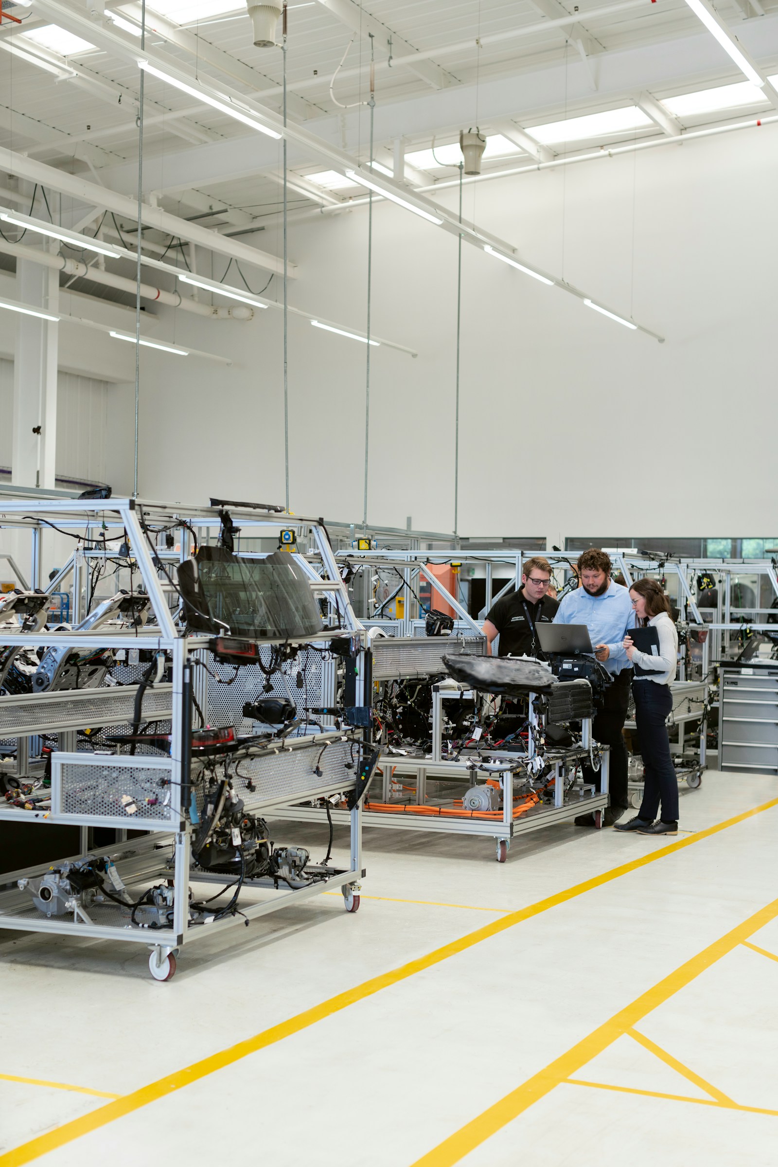 Engineers collaborating on a manufacturing floor